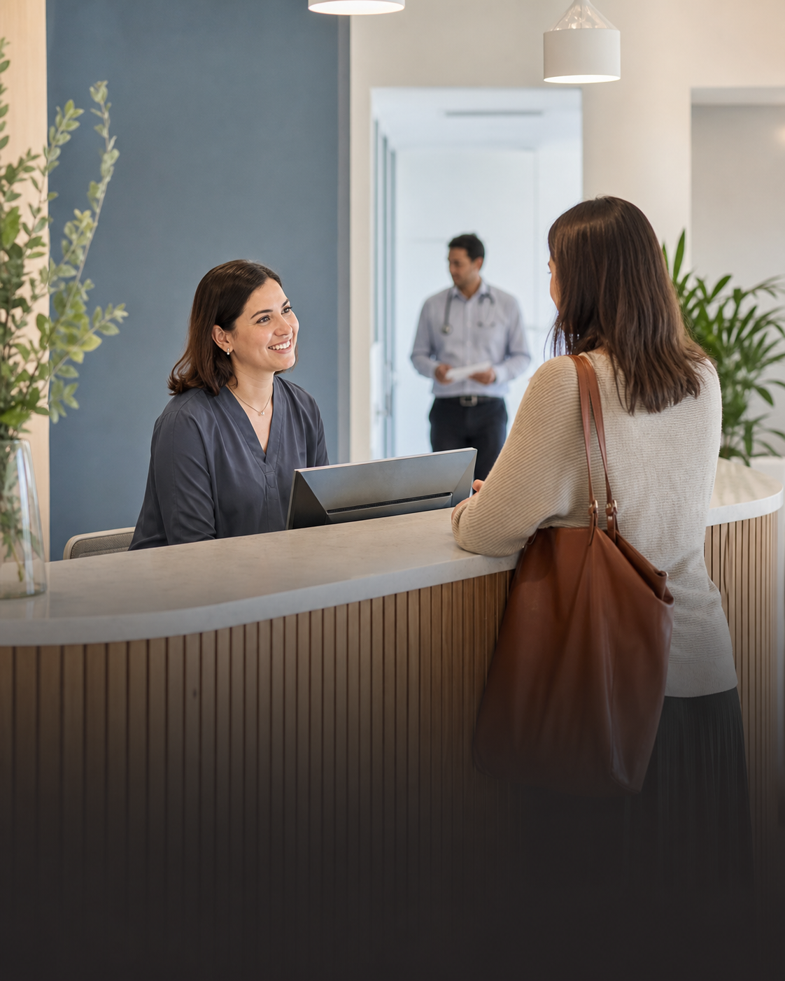 A friendly medical receptionist welcoming a patient at a modern clinic